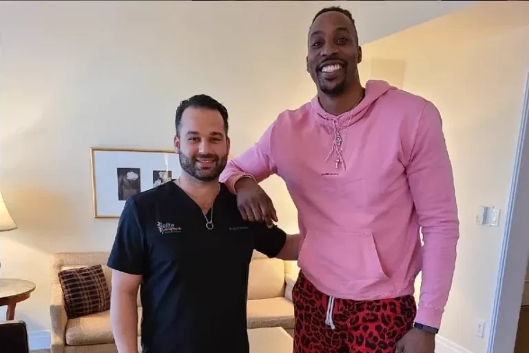 Home Page 52 Dr Jamie Mahtaban Posing With Dwight Howard Elite Chiropractic Beverly Hills Image